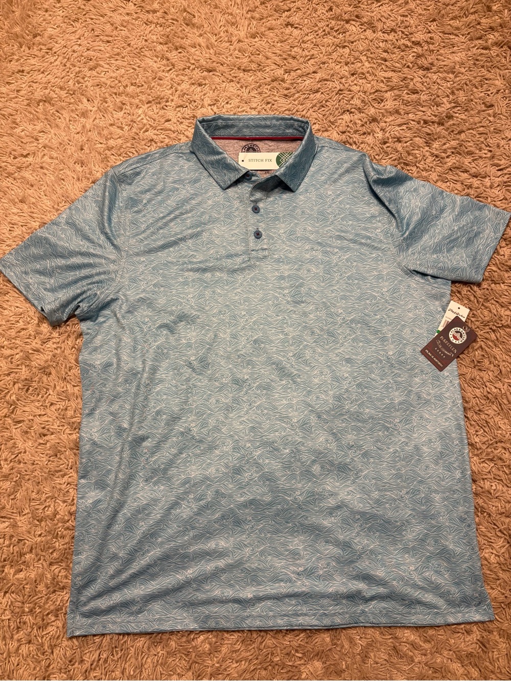 Brand New Flag & Anthem blue polo shirt with subtle wave pattern, size L